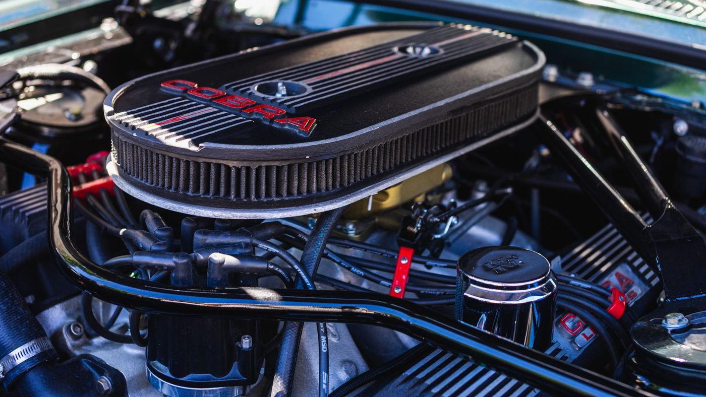 A clean engine bay with polished intake and hoses