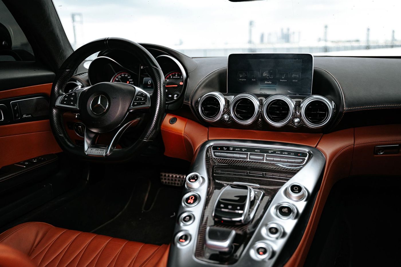 A car interior after a full detail, dashboard and console cleaned